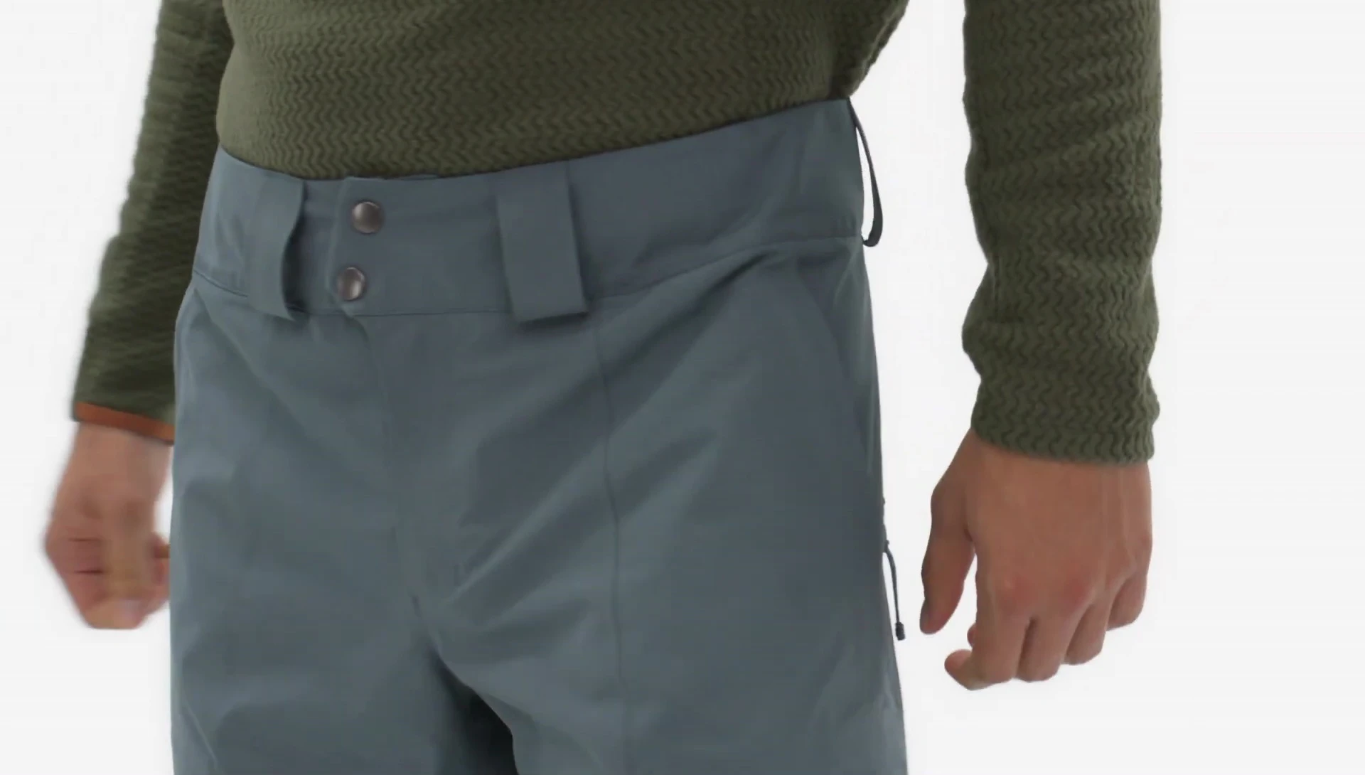 View of the waistband showcasing the dual snap closure, zip fly, and adjustable elastic tabs.