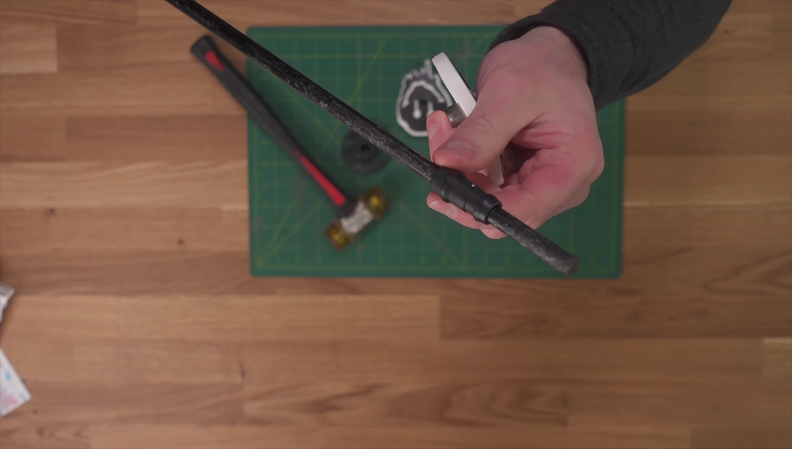 Close-up showing the sleeve on the ski pole and how it interferes with the hose clamp